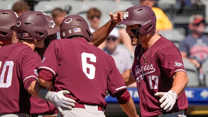 May 21, 2025; Hoover, AL, USA; Texas A&M centerfielder Jace LaViolette (17) is greeted at the plate after hitting a grand slam against Mississippi State in the first round of the SEC Baseball Tournament at the Hoover Met.