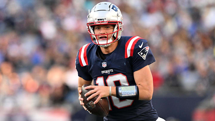 Nov 17, 2024; Foxborough, Massachusetts, USA; New England Patriots quarterback Drake Maye (10) runs with the ball against the Los Angeles Rams during the second half at Gillette Stadium. Mandatory Credit: Brian Fluharty-Imagn Images