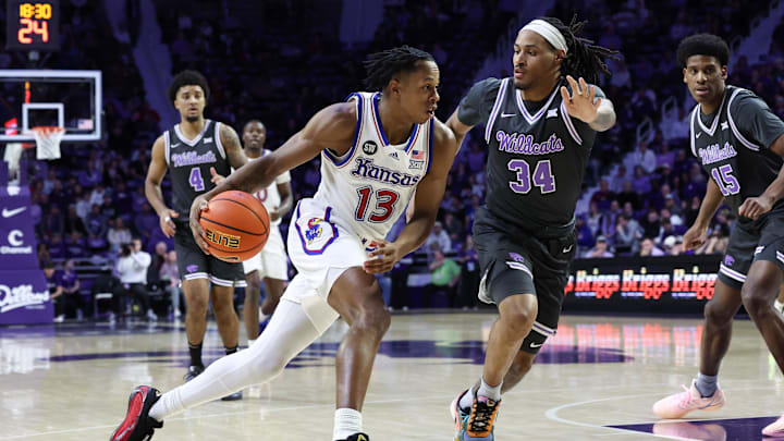 Kansas guard Elmarko Jackson dribbles against Kansas State guard Nate Johnson during the second half at Bramlage Coliseum. Kansas guard Elmarko Jackson dribbles against Kansas State guard Nate Johnson during the second half at Bramlage Coliseum.