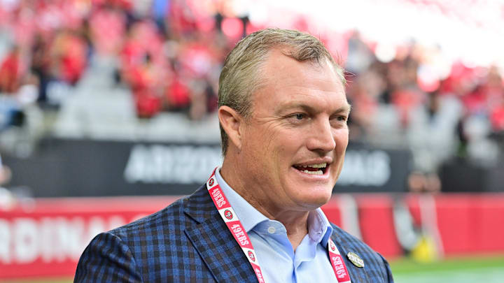 Nov 16, 2025; Glendale, Arizona, USA; San Francisco 49ers general manager John Lynch speaks on the sidelines before the game against the Arizona Cardinals at State Farm Stadium. Mandatory Credit: Matt Kartozian-Imagn Images