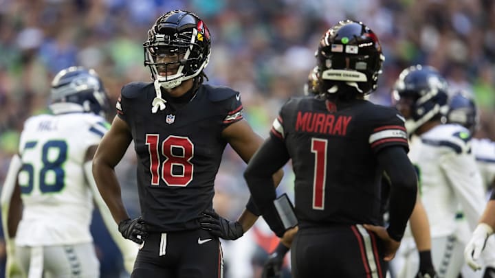 Dec 8, 2024; Glendale, Arizona, USA; Arizona Cardinals wide receiver Marvin Harrison Jr. (18) alongside quarterback Kyler Murray (1) against the Seattle Seahawks in the first half at State Farm Stadium. Mandatory Credit: Mark J. Rebilas-Imagn Images Dec 8, 2024; Glendale, Arizona, USA; Arizona Cardinals wide receiver Marvin Harrison Jr. (18) alongside quarterback Kyler Murray (1) against the Seattle Seahawks in the first half at State Farm Stadium. Mandatory Credit: Mark J. Rebilas-Imagn Images