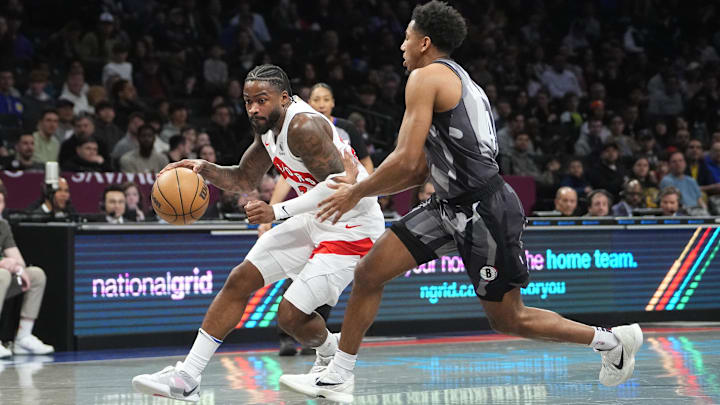Apr 6, 2025; Brooklyn, New York, USA; Jamal Shead dribbles the ball against Brooklyn Nets guard Reece Beekman (4) during the first half at Barclays Center. Mandatory Credit: Gregory Fisher-Imagn Images