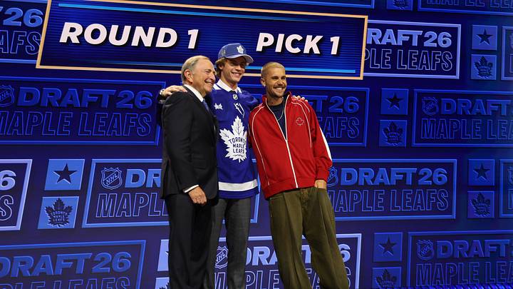 Jun 26, 2026; Buffalo, New York, USA; Gavin McKenna poses with NHL commissioner Gary Bettman and singer Justin Bieber after being selected with the first pick in the first round of the 2026 NHL Draft by the Toronto Maple Leafs at KeyBank Center. Mandatory Credit: Timothy T. Ludwig-Imagn Images