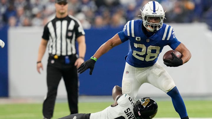 Indianapolis Colts running back Jonathan Taylor (28) is brought down by Jacksonville Jaguars safety Darnell Savage (6) on Sunday, Jan. 5, 2025, during a game against the Jacksonville Jaguars at Lucas Oil Stadium in Indianapolis.