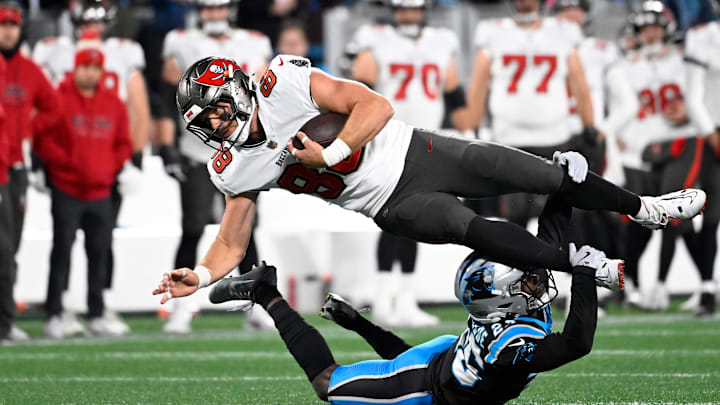 Dec 1, 2024; Charlotte, North Carolina, USA; Tampa Bay Buccaneers tight end Cade Otton (88) is tackled by Carolina Panthers cornerback Chau Smith-Wade (26) in overtime at Bank of America Stadium. Mandatory Credit: Bob Donnan-Imagn Images Dec 1, 2024; Charlotte, North Carolina, USA; Tampa Bay Buccaneers tight end Cade Otton (88) is tackled by Carolina Panthers cornerback Chau Smith-Wade (26) in overtime at Bank of America Stadium. Mandatory Credit: Bob Donnan-Imagn Images
