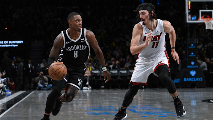 Nov 25, 2023; Brooklyn, New York, USA; Brooklyn Nets guard Lonnie Walker IV (8) drives against Miami Heat guard Jaime Jaquez Jr. (11) during the third quarter at Barclays Center. Mandatory Credit: John Jones-Imagn Images
