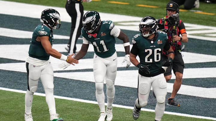 Hurts (left), Brown (middle) and Barkley (right) were reported to have had a meeting earlier this week amid the Eagles offense's struggles. 