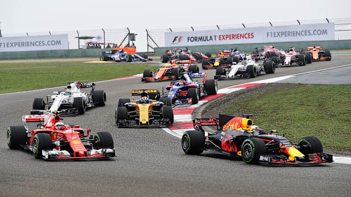 Daniel Ricciardo of Australia driving the (3) Red Bull Racing Red Bull-TAG Heuer RB13 TAG Heuer leads Kimi Raikkonen of Finland driving the (7) Scuderia Ferrari SF70H on track during the Formula One Grand Prix of China at Shanghai International Circuit on April 9, 2017 in Shanghai, China.