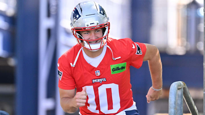 Jul 23, 2025; Foxborough, MA, USA; New England Patriots quarterback Drake Maye (10) runs out to the practice fields for day one of training camp at Gillette Stadium. Mandatory Credit: Eric Canha-Imagn Images