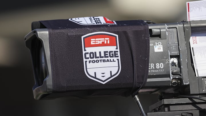 General view of a television camera with an ESPN college football sleeve