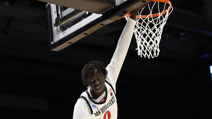 San Diego State Aztecs forward Magoon Gwath hangs from the rim in an NCAA Tournament game against North Carolina.