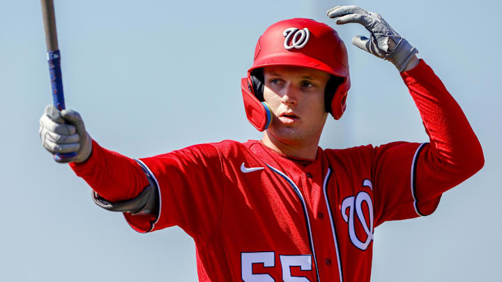 Feb 20, 2023; West Palm Beach, FL, USA; Washington Nationals outfielder Robert Hassell III (55) practices his swing during a spring training workout at The Ballpark of the Palm Beaches. 