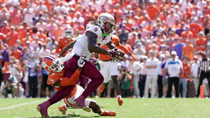 Sep 23, 2023; Clemson, South Carolina, USA; Florida State Seminoles tight end Jaheim Bell (6) is tackled in the first half by Clemson Tigers safety R.J. Mickens (9) at Memorial Stadium. Mandatory Credit: David Yeazell-USA TODAY Sports