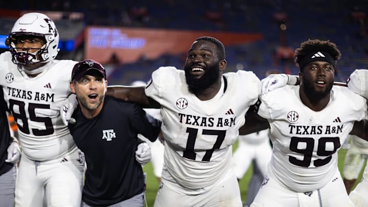 Sep 14, 2024; Gainesville, Florida, USA; Texas A&M Aggies tight end Jaden Platt (85), defensive lineman Albert Regis (17), and defensive lineman Gabriel Brownlow-Dindy (99) celebrate after defeating the Florida Gators at Ben Hill Griffin Stadium. Mandatory Credit: Matt Pendleton-Imagn Images