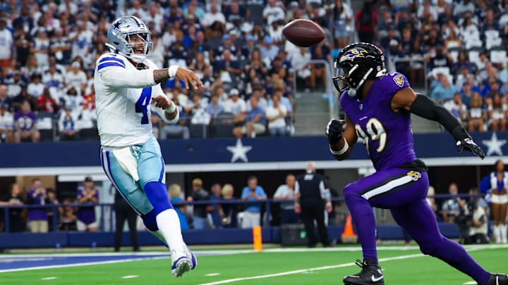 Sep 22, 2024; Arlington, Texas, USA; Dallas Cowboys quarterback Dak Prescott (4) past Baltimore Ravens linebacker Odafe Oweh (99) during the first quarter at AT&T Stadium. Mandatory Credit: Kevin Jairaj-Imagn Images Sep 22, 2024; Arlington, Texas, USA; Dallas Cowboys quarterback Dak Prescott (4) past Baltimore Ravens linebacker Odafe Oweh (99) during the first quarter at AT&T Stadium. Mandatory Credit: Kevin Jairaj-Imagn Images