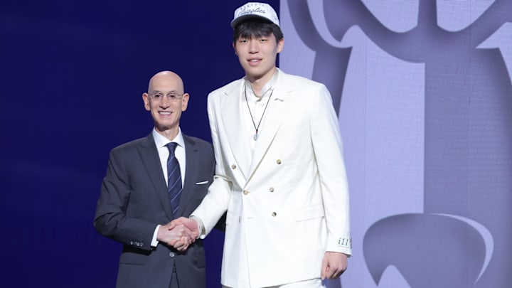 Jun 25, 2025; Brooklyn, NY, USA; Yang Hansen stands with NBA commissioner Adam Silver after being selected as the 16th pick by the Memphis Grizzlies in the first round of the 2025 NBA Draft at Barclays Center. Mandatory Credit: Brad Penner-Imagn Images Jun 25, 2025; Brooklyn, NY, USA; Yang Hansen stands with NBA commissioner Adam Silver after being selected as the 16th pick by the Memphis Grizzlies in the first round of the 2025 NBA Draft at Barclays Center. Mandatory Credit: Brad Penner-Imagn Images