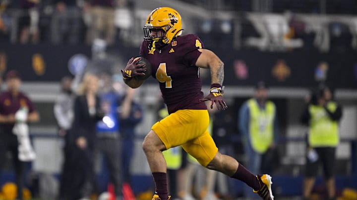 Dec 7, 2024; Arlington, TX, USA; Arizona State Sun Devils running back Cam Skattebo (4) in action during the game between the Iowa State Cyclones and the Arizona State Sun Devils at AT&T Stadium. Mandatory Credit: Jerome Miron-Imagn Images