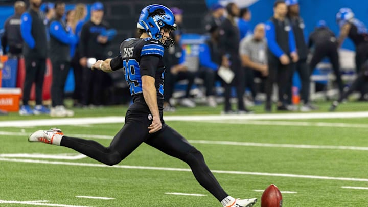 Jan 5, 2025; Detroit, Michigan, USA; Detroit Lions place kicker Jake Bates (39) kicks off the ball against the Minnesota Vikings during the first half at Ford Field.