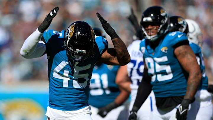 Jacksonville Jaguars linebacker K'Lavon Chaisson (45) gets fired up and slaps his helmet after a