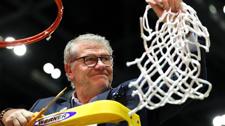 Apr 6, 2025; Tampa, FL, USA; Connecticut Huskies head coach Geno Auriemma cuts off the net after the national championship of the women's 2025 NCAA tournament against the South Carolina Gamecocks at Amalie Arena. Mandatory Credit: Nathan Ray Seebeck-Imagn Images Apr 6, 2025; Tampa, FL, USA; Connecticut Huskies head coach Geno Auriemma cuts off the net after the national championship of the women's 2025 NCAA tournament against the South Carolina Gamecocks at Amalie Arena. Mandatory Credit: Nathan Ray Seebeck-Imagn Images