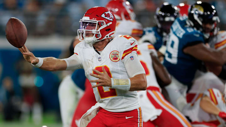 Kansas City Chiefs quarterback Ian Book (2) hits a shovel pass during the fourth quarter of a preseason NFL football game Saturday, Aug. 10, 2024 at EverBank Stadium in Jacksonville, Fla. The Jacksonville Jaguars defeated the Kansas City Chiefs 26-13.