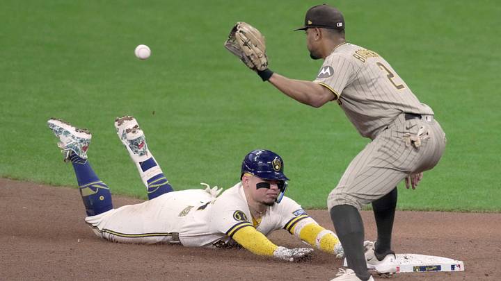Milwaukee Brewers catcher William Contreras (24) beats the throw to San Diego Padres shortstop Xander Bogaerts (2) for a double during the fourth inning of their game Tuesday, May 12, 2026 at American Family Field in Milwaukee, Wisconsin.

Mark Hoffman/Milwaukee Journal Sentinel