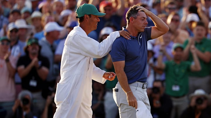 Rory McIlroy celebrates with his caddy, Harry Diamond, after winning in a playoff on the 18th green during the final round of the Masters. Rory McIlroy celebrates with his caddy, Harry Diamond, after winning in a playoff on the 18th green during the final round of the Masters.