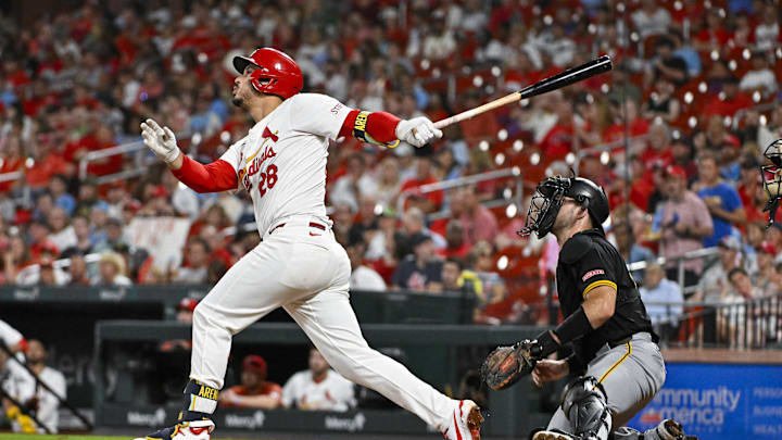 Sep 18, 2024; St. Louis, Missouri, USA;  St. Louis Cardinals third baseman Nolan Arenado (28) hits a one run single against the Pittsburgh Pirates during the third inning at Busch Stadium. Mandatory Credit: Jeff Curry-Imagn Images