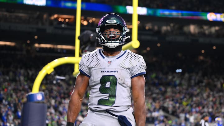 Dec 18, 2025; Seattle, Washington, USA; Seattle Seahawks running back Kenneth Walker III (9) celebrates after scoring a touchdown against the Los Angeles Rams in the second half at Lumen Field. Mandatory Credit: Steven Bisig-Imagn Images