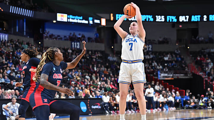 Mar 28, 2025; Spokane, WA, USA; UCLA Bruins guard Elina Aarnisalo, right, shoots against Ole Miss Rebels forward Starr Jacobs (7) during the second half of a Sweet 16 NCAA Tournament basketball game at Spokane Arena. at Spokane Arena. Mandatory Credit: James Snook-Imagn Images