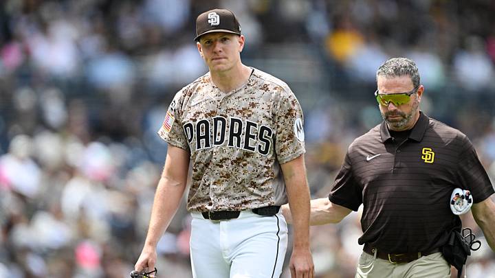 Apr 12, 2026; San Diego, California, USA; San Diego Padres starting pitcher Nick Pivetta (27), left, leaves the field with a trainer during the fourth inning against the Colorado Rockies at Petco Park. Mandatory Credit: Denis Poroy-Imagn Images Apr 12, 2026; San Diego, California, USA; San Diego Padres starting pitcher Nick Pivetta (27), left, leaves the field with a trainer during the fourth inning against the Colorado Rockies at Petco Park. Mandatory Credit: Denis Poroy-Imagn Images