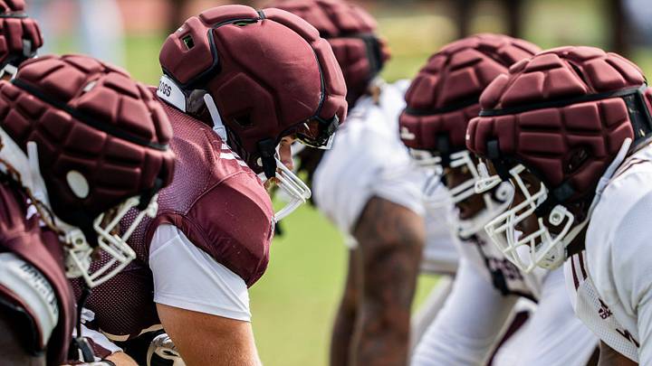 Mississippi State offensive and defensive lines square off during a preseason football practice. Mississippi State offensive and defensive lines square off during a preseason football practice.