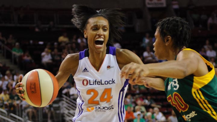 Jul 8, 2012; Seattle, WA, USA; Phoenix Mercury forward DeWanna Bonner (24) moves towards the basket while being guarded by Seattle Storm guard Tanisha Wright (30) during the 1st half at KeyArena. Mandatory Credit: Steven Bisig-Imagn Images