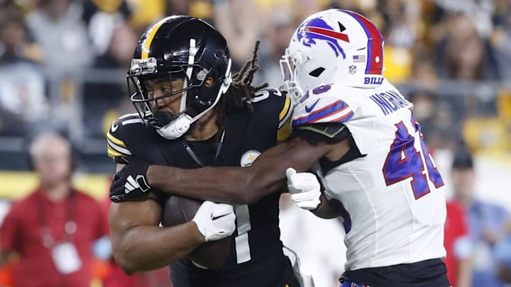 Aug 17, 2024; Pittsburgh, Pennsylvania, USA;  Pittsburgh Steelers tight end MyCole Pruitt (81) runs after a catch as Buffalo Bills cornerback Ja'Marcus Ingram (46) tackles during the third quarter at Acrisure Stadium. Buffalo won 9-3. Mandatory Credit: Charles LeClaire-Imagn Images