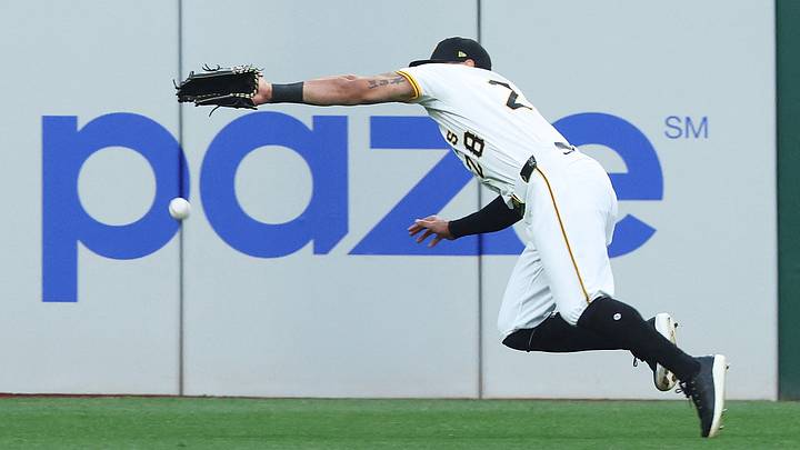 Sep 6, 2025; Pittsburgh, Pennsylvania, USA;  Pittsburgh Pirates left fielder Tommy Pham (28) attempts to catch a ball hit for a double by Milwaukee Brewers first baseman  Andrew Vaughn (not pictured) during the fourth inning at PNC Park. Mandatory Credit: Charles LeClaire-Imagn Images