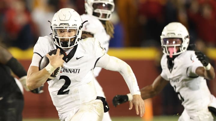 Nov 16, 2024; Ames, Iowa, USA; Cincinnati Bearcats quarterback Brendan Sorsby (2) runs for a touchdown against the Iowa State Cyclones at Jack Trice Stadium. The Iowa State Cyclones won the game 34-17.  Mandatory Credit: Reese Strickland-Imagn Images