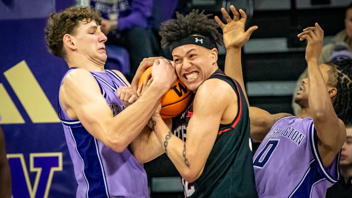 Hannes Steinbach wrestles a Utah player for a rebound. 