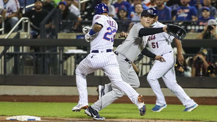 Sep 12, 2021; New York City, New York, USA; New York Yankees first baseman Anthony Rizzo (48) is pulled off the bag by a throw allowing New York Mets second baseman Javier Baez (23) to reach base safely in the first inning at Citi Field. Mandatory Credit: Wendell Cruz-Imagn Images Sep 12, 2021; New York City, New York, USA; New York Yankees first baseman Anthony Rizzo (48) is pulled off the bag by a throw allowing New York Mets second baseman Javier Baez (23) to reach base safely in the first inning at Citi Field. Mandatory Credit: Wendell Cruz-Imagn Images