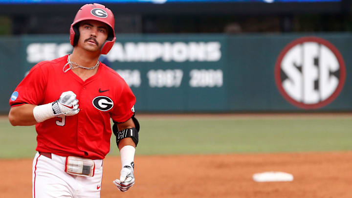 Georgia's Kolby Branch (9) celebrates after hitting a grand slam during a NCAA Athens Regional baseball game against UNCW in Athens, Ga., on Saturday, June 1, 2024.