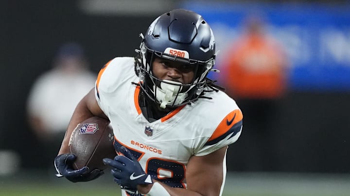 Denver Broncos running back Jaleel McLaughlin (38) carries the ball a