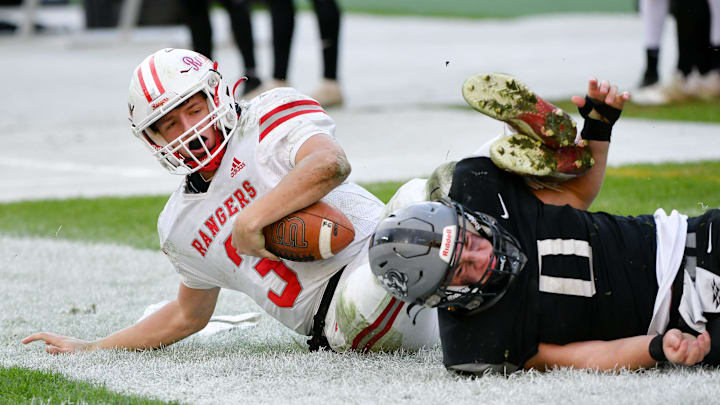 South Side's Ryan Navarra tackles Fort Cherry's Matt Sieg during Friday's Class 1A WPIAL championship game.