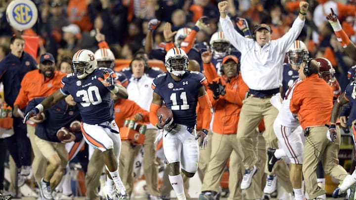 Nov 30, 2013; Auburn, AL, USA; Auburn Tigers cornerback Chris Davis (11) scores a 100 yard touchdown on a missed field goal attempt during the fourth quarter against the Alabama Crimson Tide at Jordan Hare Stadium. Auburn Tigers won 34-28. Mandatory Credit: John David Mercer-Imagn Images