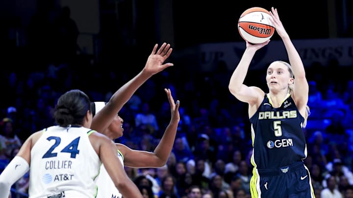 May 16, 2025; Arlington, Texas, USA;  Dallas Wings guard Paige Bueckers (5) shoots over Minnesota Lynx forward Napheesa Collier (24) during the second half at College Park Center. Mandatory Credit: Kevin Jairaj-Imagn Images