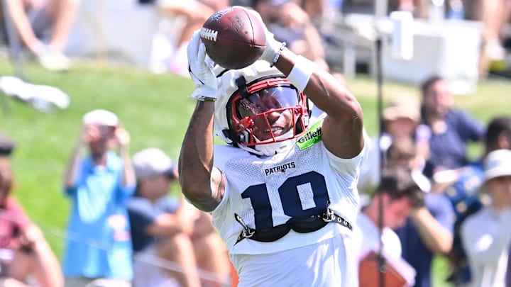 Jul 28, 2025; Foxborough, MA, USA; New England Patriots wide receiver Kyle Williams (18) makes a catch during training camp at Gillette Stadium. Mandatory Credit: Eric Canha-Imagn Images