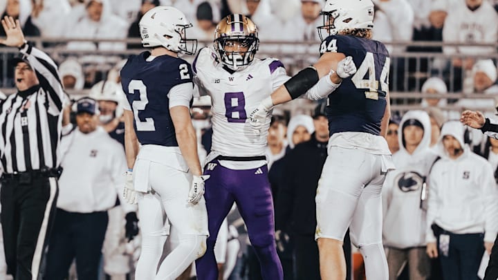 Cameron Broussard gets hemmed in by a pair of Penn State players.