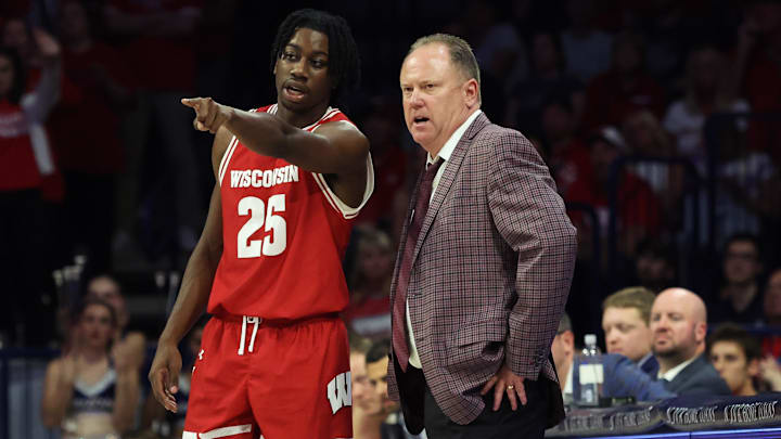 Dec 9, 2023; Tucson, Arizona, USA; Wisconsin Badgers guard John Blackwell (25) talks to Wisconsin Badgers head coach Greg Gard during the second half at McKale Center. Mandatory Credit: Zachary BonDurant-Imagn Images