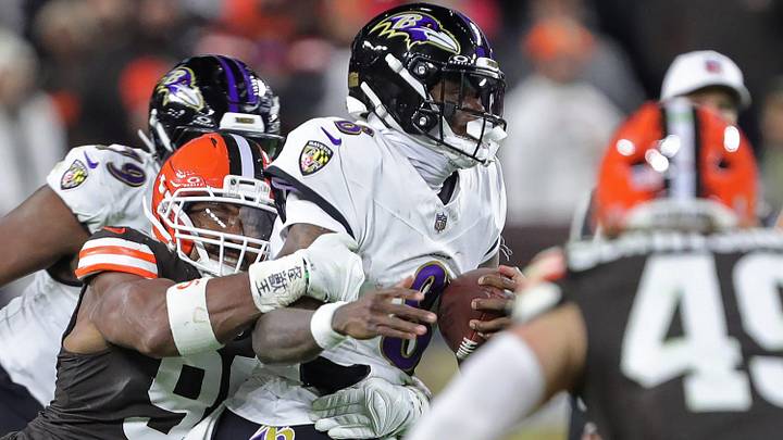 Cleveland Browns defensive end Myles Garrett (95) gets to Baltimore Ravens quarterback Lamar Jackson (8) during the second half of an NFL football game at Huntington Bank Field, Nov. 16, 2025, in Cleveland, Ohio. Cleveland Browns defensive end Myles Garrett (95) gets to Baltimore Ravens quarterback Lamar Jackson (8) during the second half of an NFL football game at Huntington Bank Field, Nov. 16, 2025, in Cleveland, Ohio.