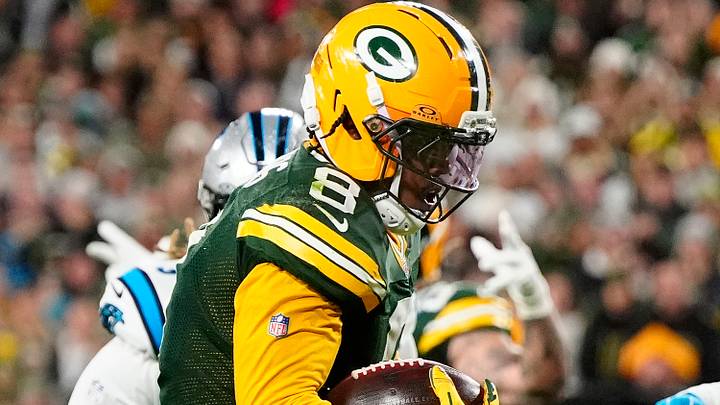 Green Bay Packers running back Josh Jacobs (8) scores a rushing touchdown against the Carolina Panthers. Green Bay Packers running back Josh Jacobs (8) scores a rushing touchdown against the Carolina Panthers.