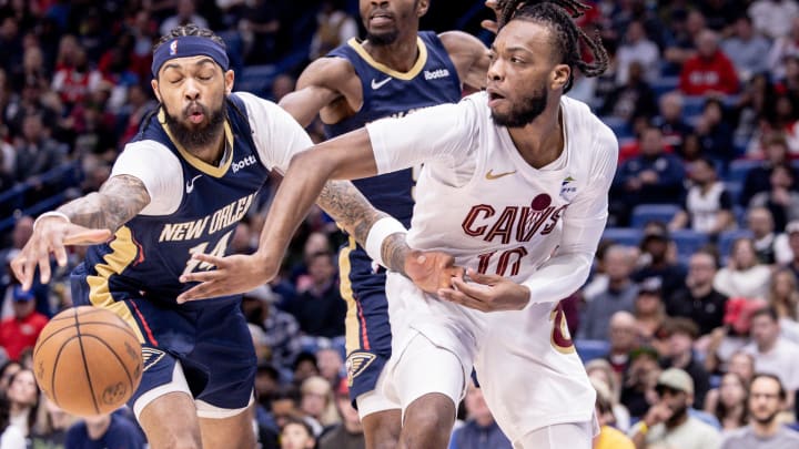 Mar 13, 2024; New Orleans, Louisiana, USA;  Cleveland Cavaliers guard Darius Garland (10) looks to pass the ball against New Orleans Pelicans forward Brandon Ingram (14) during the first half at Smoothie King Center. Mandatory Credit: Stephen Lew-USA TODAY Sports