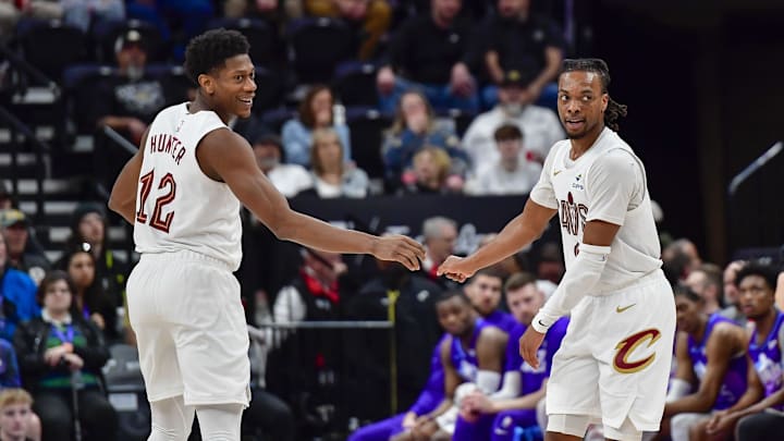 Mar 23, 2025; Salt Lake City, Utah, USA; Cleveland Cavaliers guard Darius Garland (10) and Cleveland Cavaliers forward/guard De'Andre Hunter (12) celebrate after a three point shot against the Utah Jazz during the second half at Delta Center. Mandatory Credit: Peter Creveling-Imagn Images